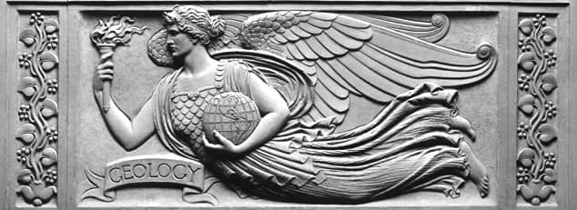 A low relief panel, or frieze, by Henry Hering depicting a winged female figure wearing a flowing gown and holding a globe with North and South American continents and a torch representing fire.